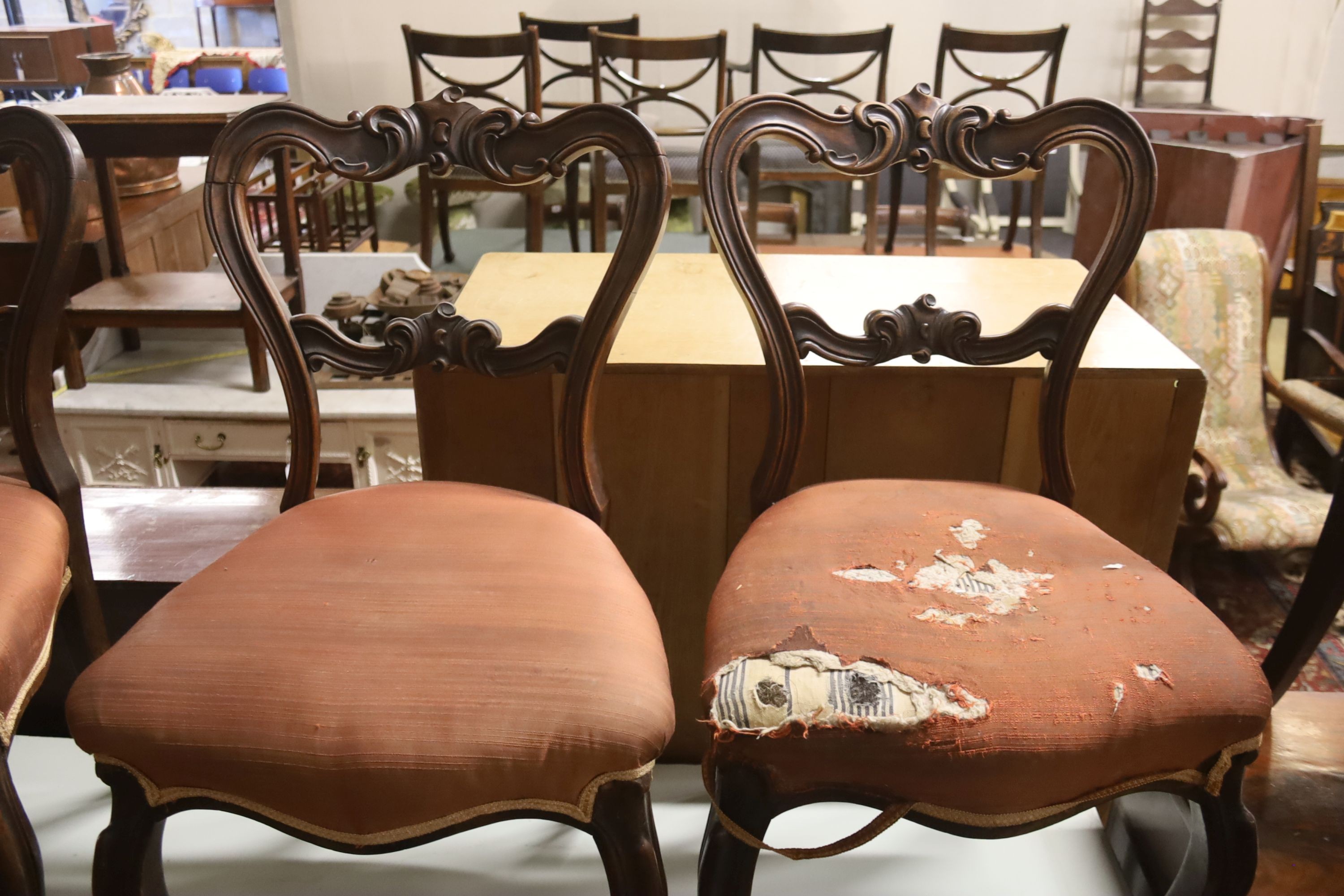 A set of six Victorian carved rosewood balloon back dining chairs